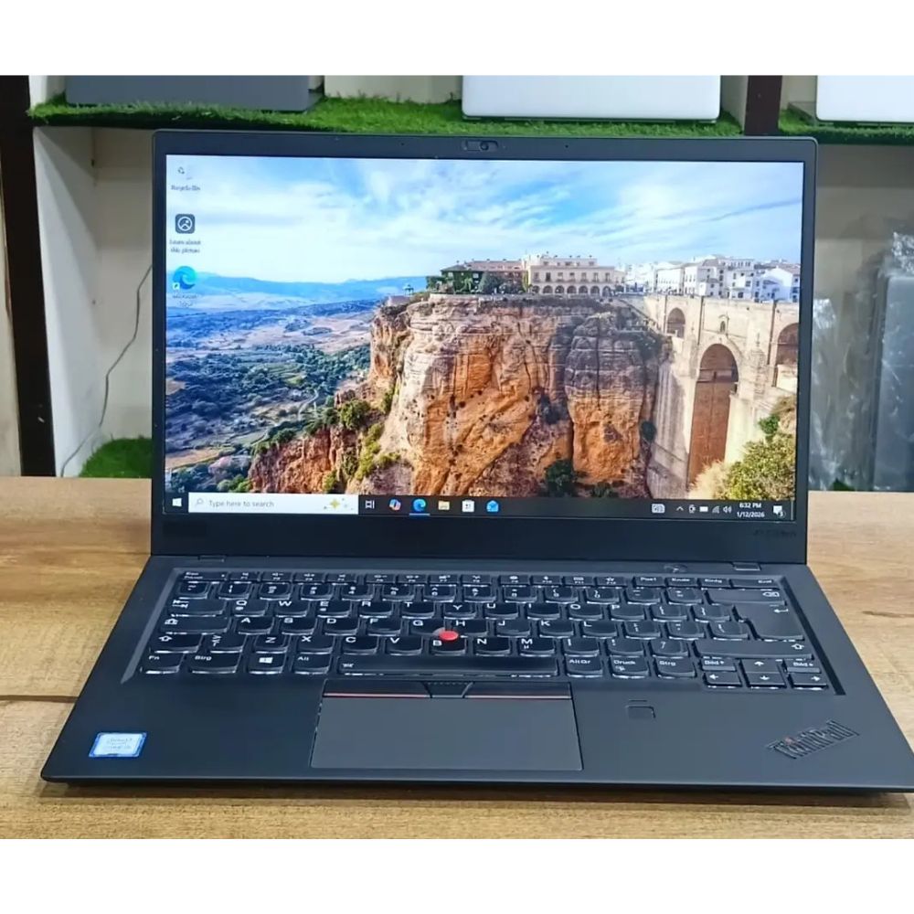 Lenovo ThinkPad X1 Carbon Premium Ultra-Lightweight Business Laptop Matte black Lenovo ThinkPad X1 Carbon laptop open on an executive desk showing the iconic red TrackPoint.
